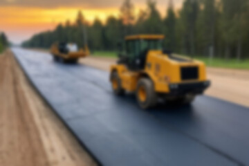 Blurry photo of the construction process of repairing/paving the highway using modern tools.