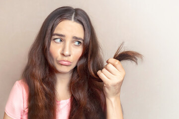 Woman has cropped, cut, weakened hair. She doesn't like them. Close up photo copy space