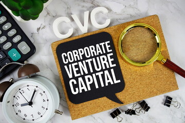 CVC - Corporate Venture Capital acronym with calculator, alarm clock and magnifying glass, business...