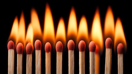Cascading flames of matchsticks a closeup view of hot burning light in a dark environment