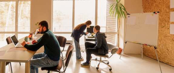 three young people working in office for background