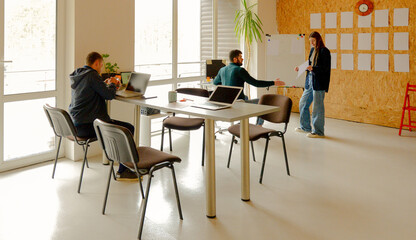 three young people working in office for background