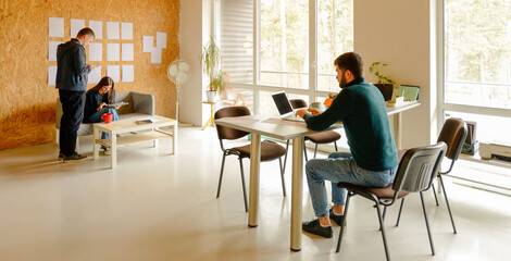 three young people working in office for background