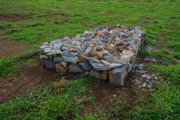 Stone Structure on Green Grass in an Open Outdoor Field