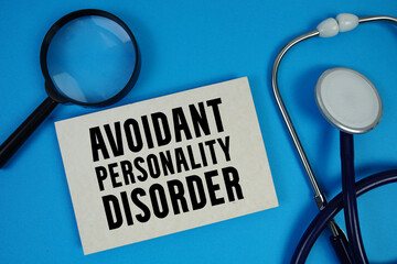 Avoidant Personality Disorder  text with Stethoscope and magnifying glass on blue background