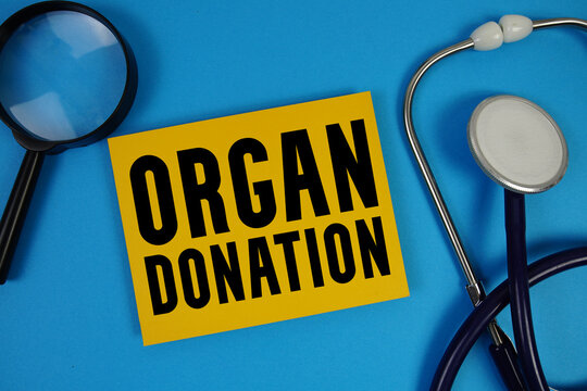 Organ Donation  text with Stethoscope and magnifying glass on blue background - Powered by Adobe