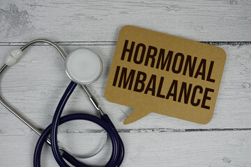 Hormonal Imbalance text with Stethoscope on wooden background
