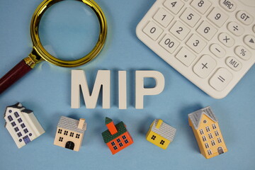 MIP abbreviation of Mortgage Insurance Premium alphabet letters with house model, magnifying glass...