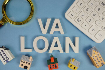 VA LOAN Veterans Affairs alphabet letters with house model, magnifying glass and calculator on blue...