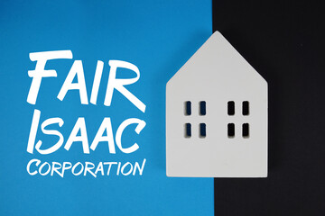 FICO Fair Isaac Corporation text with house models on blue background
