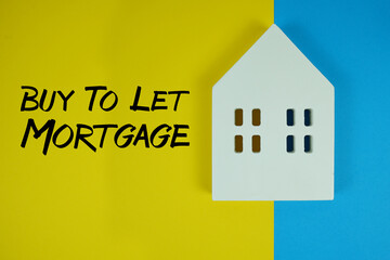 Buy To Let Mortgage text with house models on yellow background