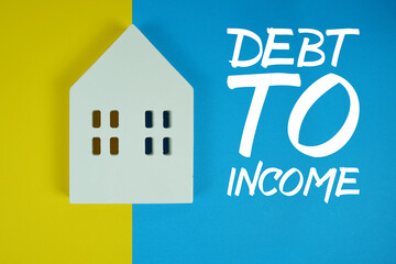 DTI Debt To Income Ratio text with house models on blue background