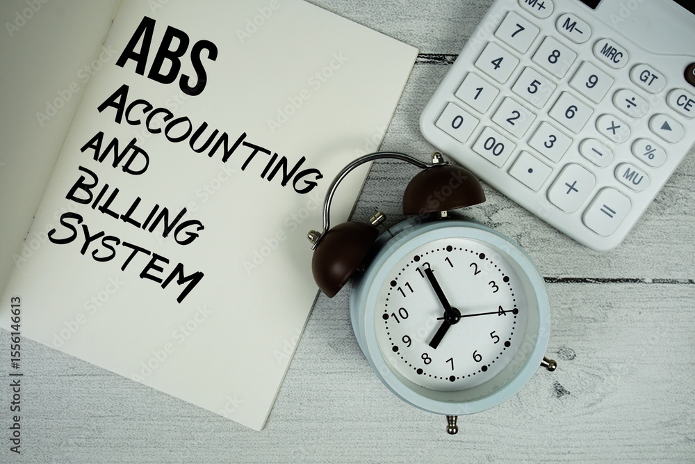Poster abs accounting and billing system text on paper notebook page with alarm clock and calculator on woo