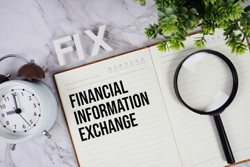 FIX - Financial Information Exchange acronym on notepad, Business concept background