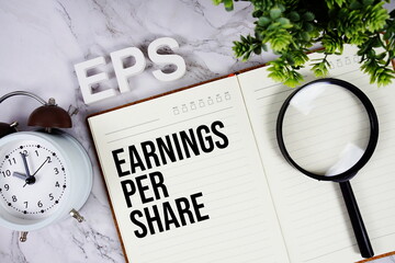 EPS - Earnings Per Share acronym on notepad, Business concept background