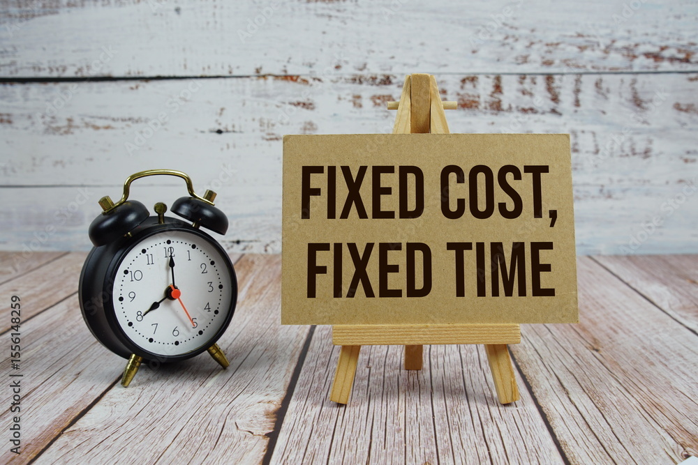 Poster fixed cost, fixed time text with easel and alarm clock on wooden background