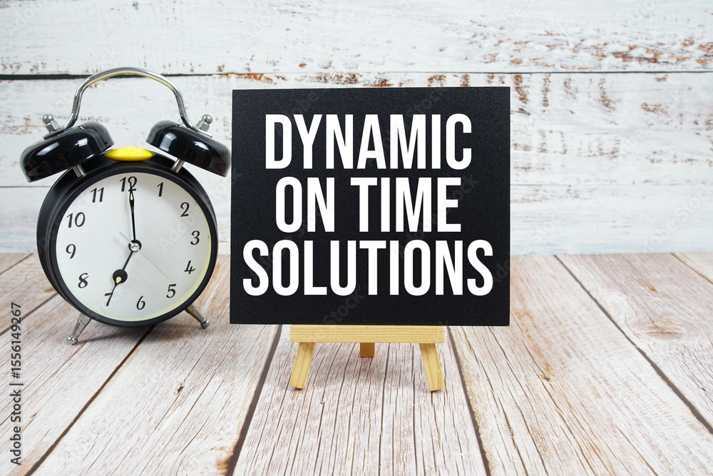 Poster dynamic on time solutions text with easel and alarm clock on wooden background