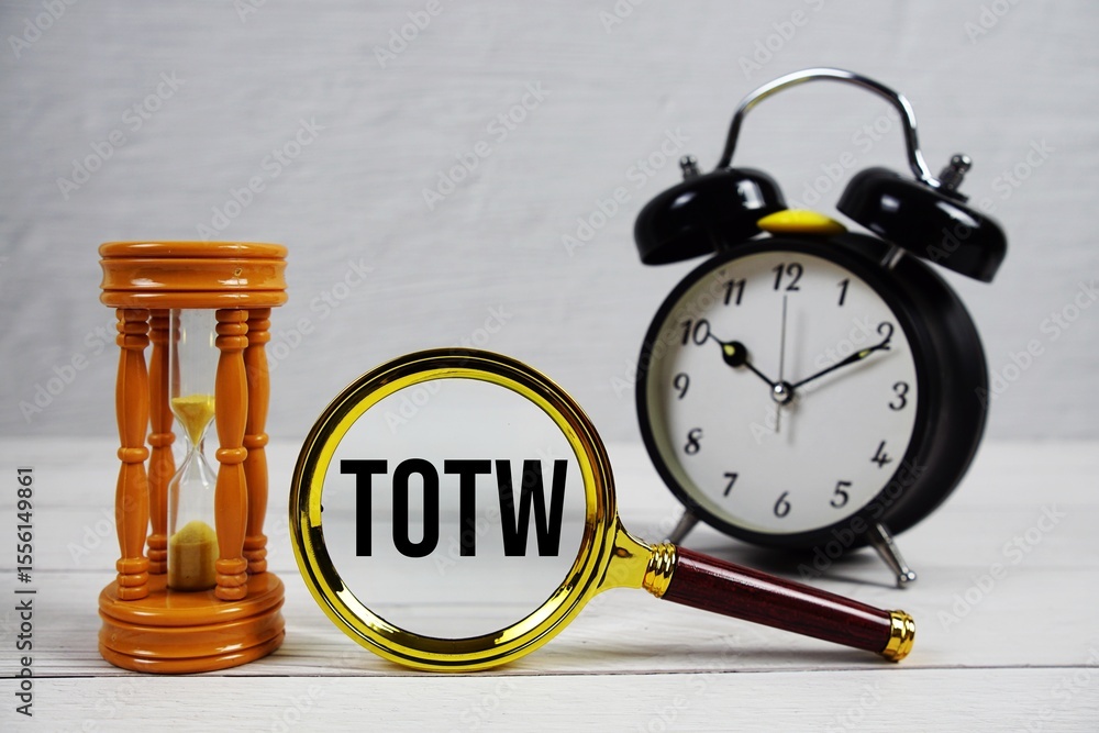 Poster totw abbreviation of time off for time worked text with alarm clock on wooden background