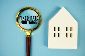 Fixed-Rate Mortgage with house model and magnifying glass on blue background