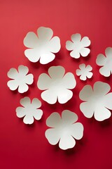 White Paper Flower Cuttings on Red Background with Natural Shadows – Minimalist Artistic Composition