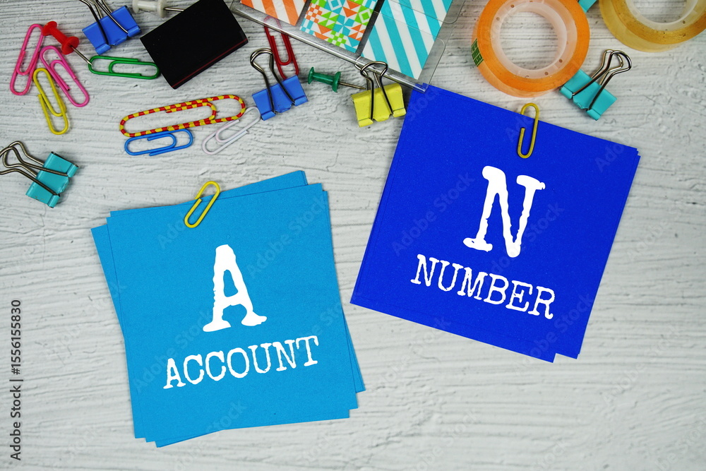 Poster an - account number text on stick note with stationery on concrete background