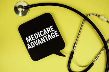 Medicare Advantage text on speech bubble with stethoscope on yellow background, Healthy concept