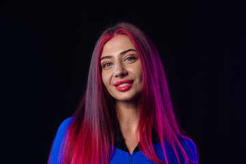 Woman in futuristic blue bodysuit with long pink hair