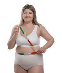 Weight loss. Plus size woman measuring waist with tape on white background