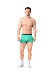 Fototapeta premium Young man in stylish turquoise underwear on white background
