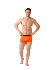 Fototapeta premium Young man in stylish orange underwear on white background