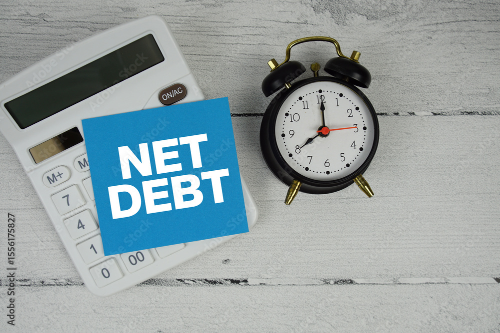 Fototapete net debt text with calculator and alarm clock on wooden background