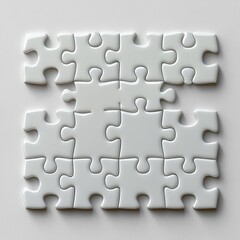 A collection of white puzzle pieces partially connected together