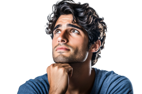 Pensive young man with thoughtful expression gazing upwards, reflecting on life and contemplating future decisions in an isolated dark background