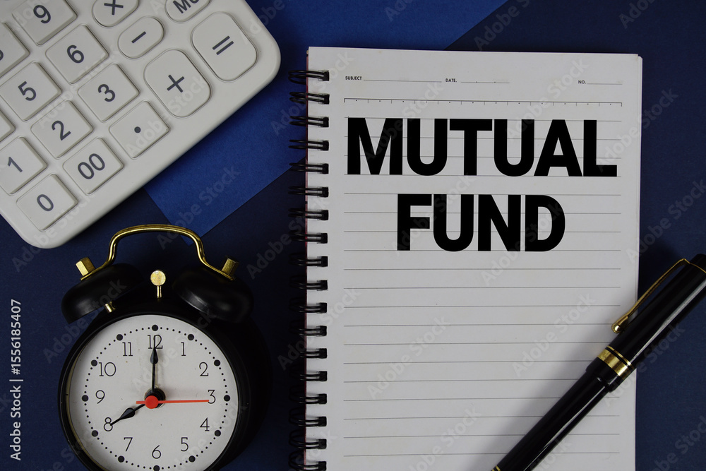 Aufkleber mutual fund text written on notepad with calculator and alarm clock on navy blue background