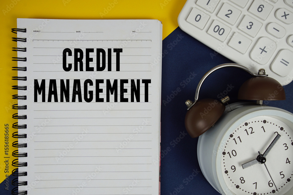 Poster credit management text written on notepad with calculator and alarm clock on navy blue background