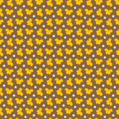 Yellow Autumn Leaves and Blue Accents on Brown Patterned Background