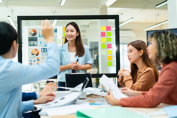 Fototapeta premium Group of creative Businesspeople brain storm meeting presentation,discussing roadmap to product launch, planning,strategy,dashboard,new business development,working with new startup project in office