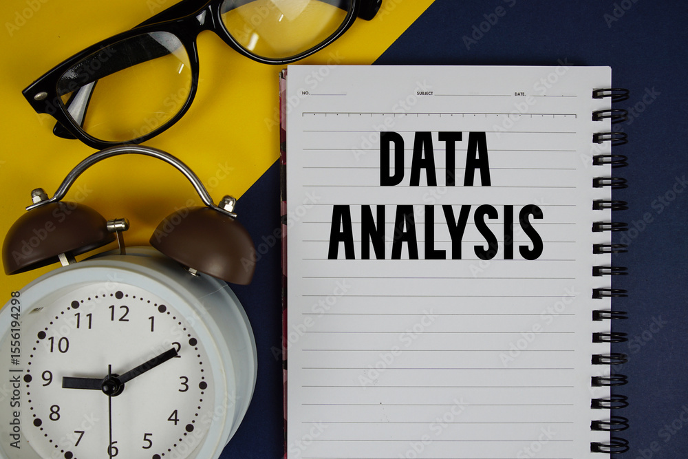 Aufkleber data analysis text written on notepad with alarm clock on blue background