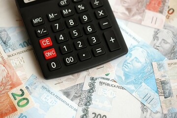 Brazilian reais banknotes and calculator. The current Brazil real money bills and calculator