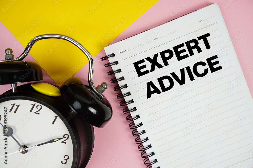 Poster expert advice text written on notepad with alarm clock on pink background