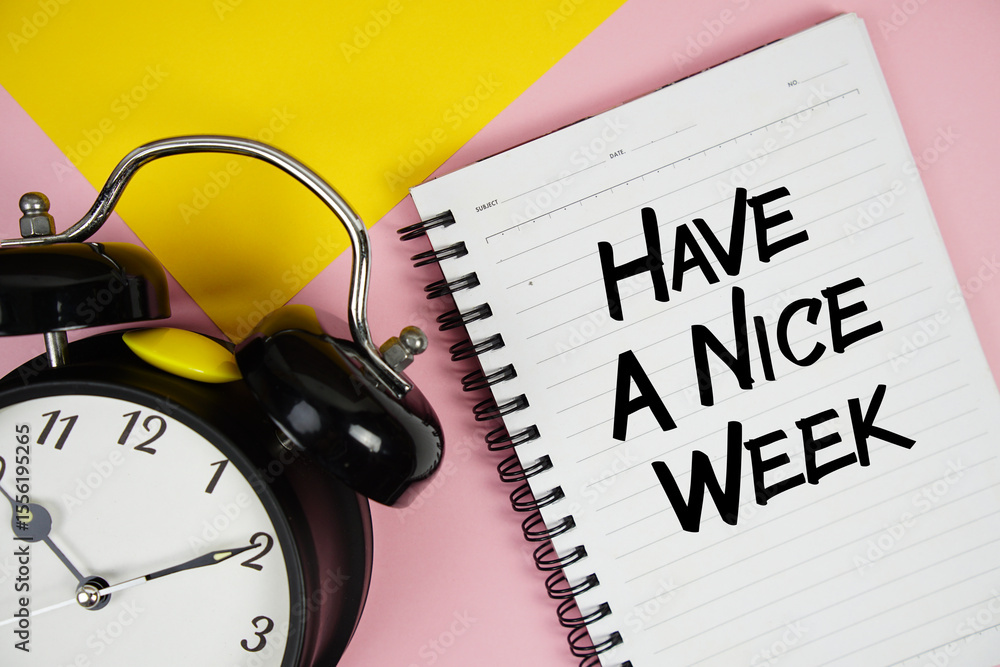 Poster have a nice week text written on notepad with alarm clock on pink background