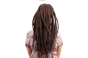 Girl with dreadlocks in a checkered shirt.