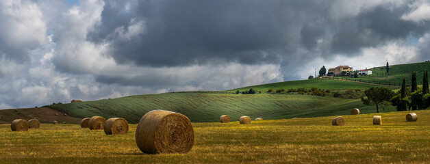 landscape with hay bales in Tuscany, Italy © James