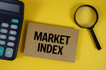 Market Index text with magnifying glass anc calculator on yellow background