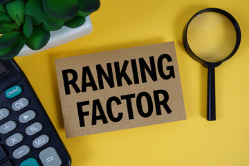 Ranking Factor text with magnifying glass anc calculator on yellow background