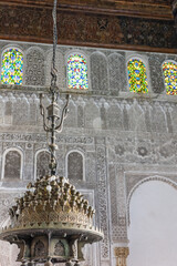 Closeup view of the ancient chandelier in Al-Attarine Madrasa in Fes, Morocco. Vertically. 