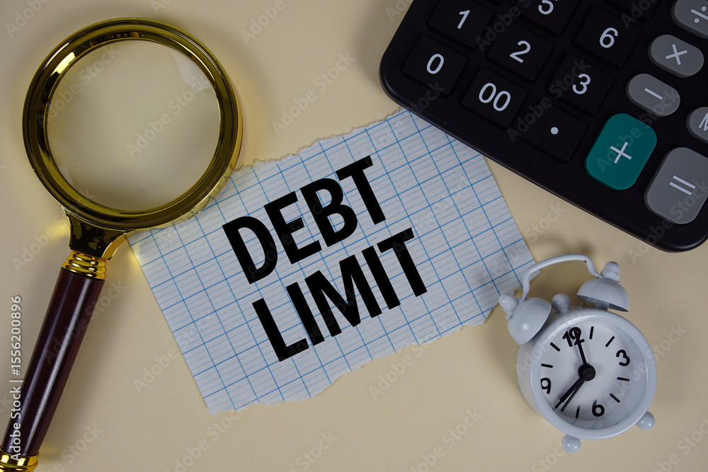 Poster debt limit text with alarm clock, magnifying glass anc calculator on yellow background
