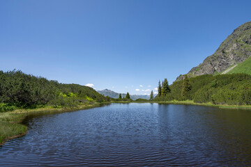 blue mountain lake Wiegensee with fantastic view in Partennen Gaschurn Montafon in Vorarlberg...
