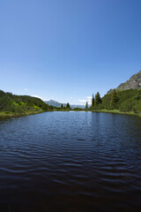 blue mountain lake Wiegensee with fantastic view in Partennen Gaschurn Montafon in Vorarlberg...
