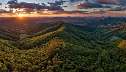 Panoramic sunset over rolling green hills